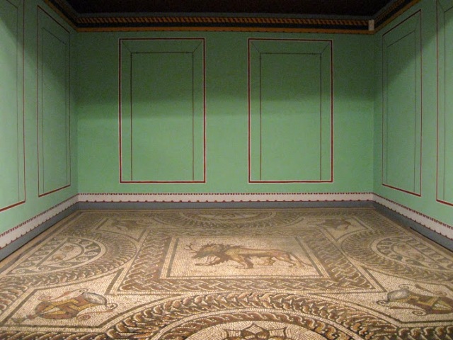 Reconstruction of what would have been a dining room in a Roman villa. The floor would have been a mosaic on which couches would have been placed for the family to have their wine and grapes :-)
