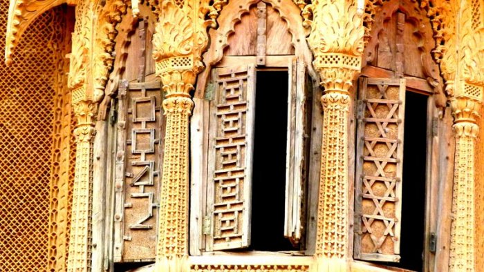 Carved stonework and carved windows. I can't decide which one is more beautifulc